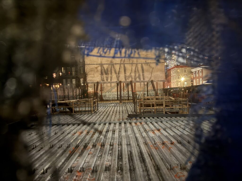 Photo of a construction site with a giant "MY BAD" spraypanted on a 3 storey wall.